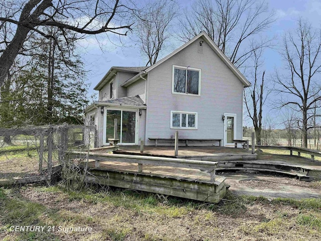 5207 S Whiteville Rd, Mount Pleasant, MI 48858 - rear view of property featuring a wooden deck