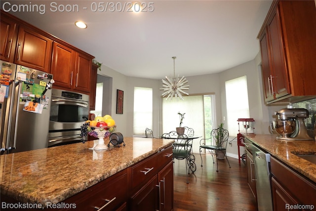 13961 Cobblestone Creek Dr, Belleville, MI 48111 - kitchen featuring stainless steel appliances, dark wood-style floors, light stone counters, recessed lighting, and a chandelier