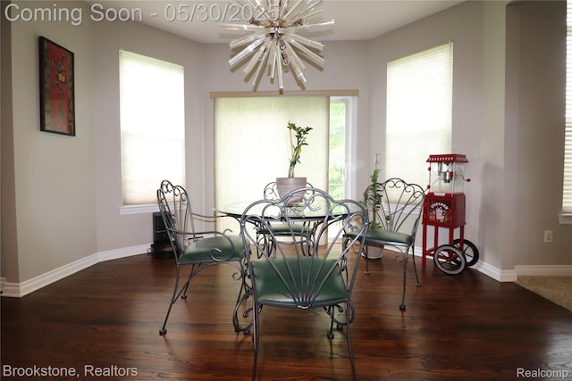 13961 Cobblestone Creek Dr, Belleville, MI 48111 - dining area with a chandelier, wood finished floors, and baseboards