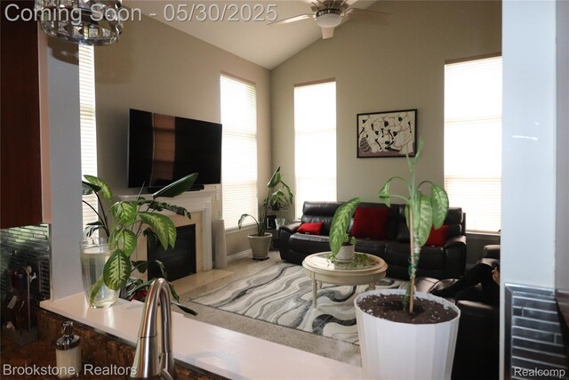 13961 Cobblestone Creek Dr, Belleville, MI 48111 - living room featuring ceiling fan, lofted ceiling, a fireplace, and a chandelier