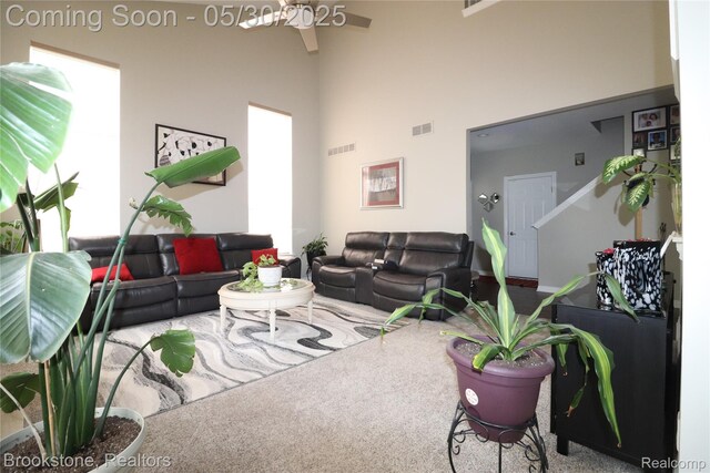 13961 Cobblestone Creek Dr, Belleville, MI 48111 - living room with a ceiling fan, a high ceiling, carpet floors, and plenty of natural light