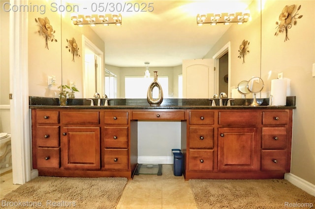 13961 Cobblestone Creek Dr, Belleville, MI 48111 - bathroom featuring vanity, toilet, tile patterned floors, and baseboards
