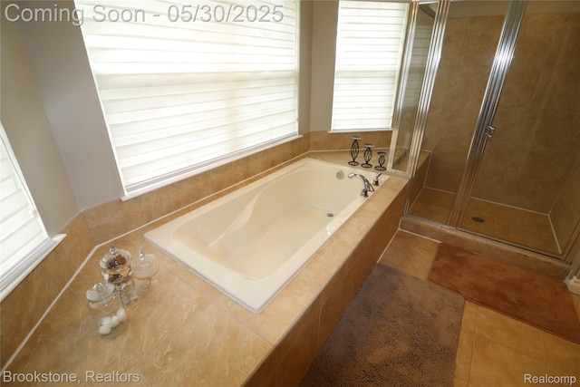 13961 Cobblestone Creek Dr, Belleville, MI 48111 - bathroom with a garden tub, a shower stall, and tile patterned floors