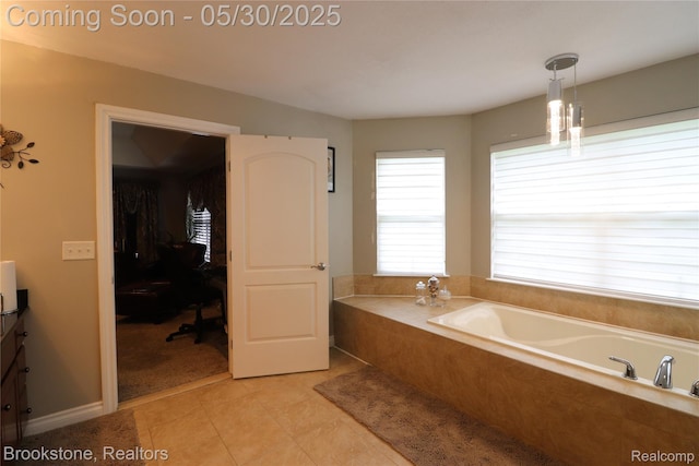 13961 Cobblestone Creek Dr, Belleville, MI 48111 - bathroom with vanity, a garden tub, and tile patterned floors