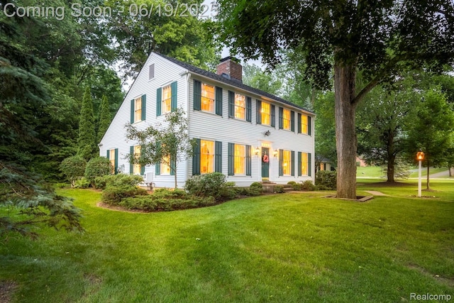 18410 Fermanagh Ct, Northville, MI 48168 - colonial inspired home with a chimney and a front lawn