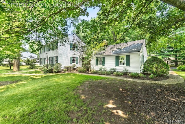 18410 Fermanagh Ct, Northville, MI 48168 - colonial-style house featuring a front lawn