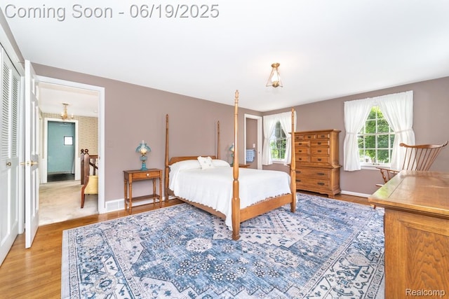 18410 Fermanagh Ct, Northville, MI 48168 - bedroom with light wood-style floors and baseboards