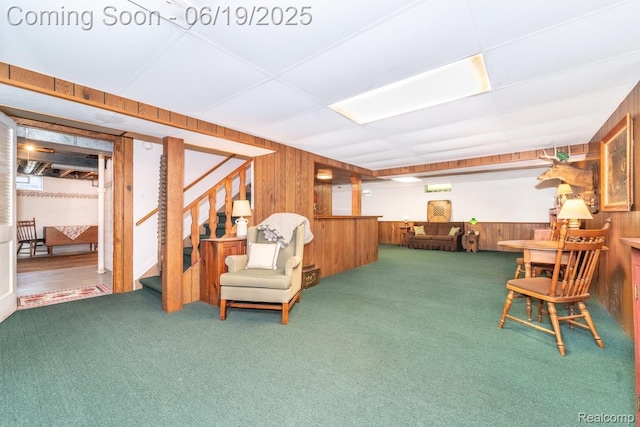 18410 Fermanagh Ct, Northville, MI 48168 - living area with wooden walls, carpet, and stairway