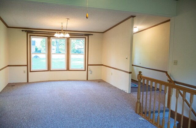 6340 Warren Woods Rd, Three Oaks, MI 49128 - carpeted empty room with ornamental molding and a chandelier