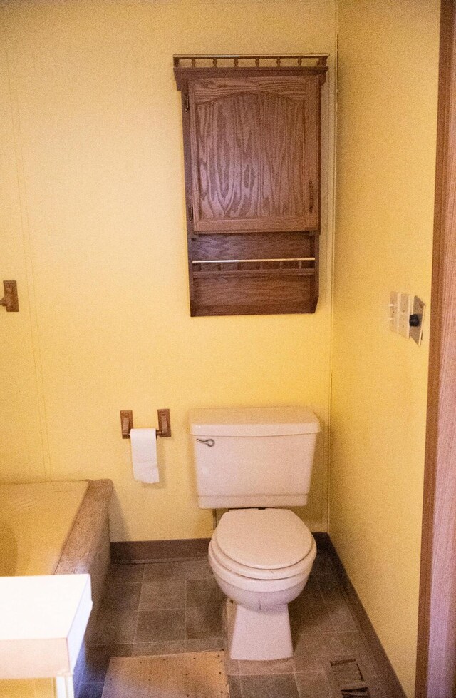 6340 Warren Woods Rd, Three Oaks, MI 49128 - bathroom with toilet, baseboards, and tile patterned floors