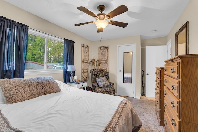 1094 Lake Marie Dr, Horton, MI 49246 - bedroom featuring carpet flooring, ceiling fan, and baseboards
