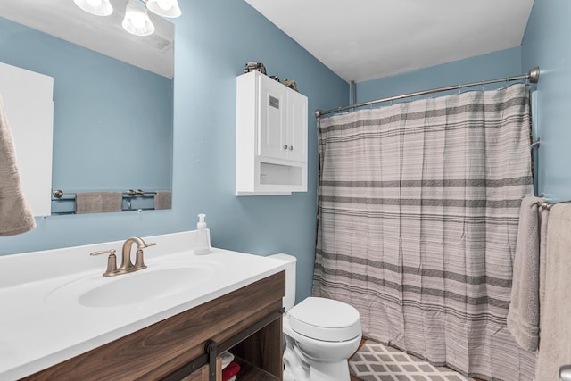 1094 Lake Marie Dr, Horton, MI 49246 - bathroom with vanity, toilet, and a shower with shower curtain