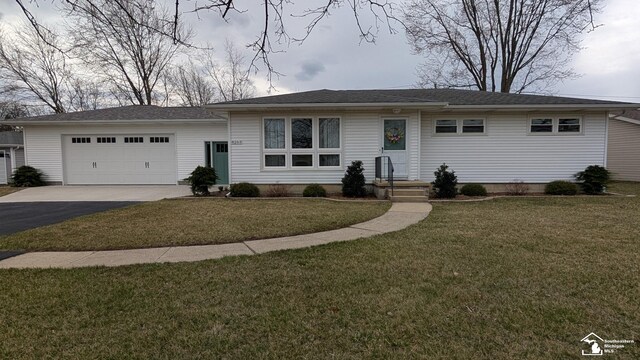 8263 Westwood St, Ida, MI 48140 - single story home featuring a garage, driveway, and a front lawn