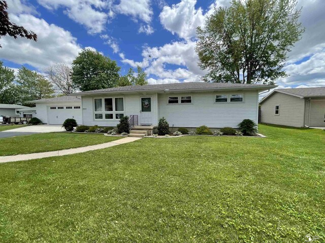 8263 Westwood St, Ida, MI 48140 - ranch-style house featuring a garage, driveway, and a front lawn