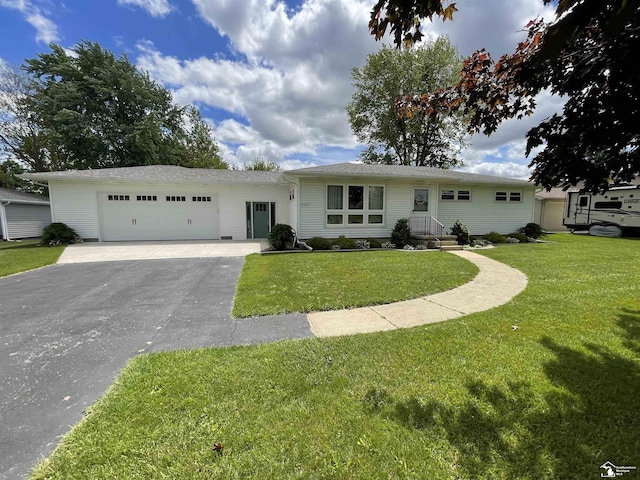 8263 Westwood St, Ida, MI 48140 - ranch-style house featuring driveway, an attached garage, and a front lawn