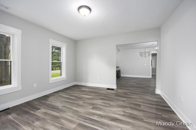 536 E Grant St, Sheridan, MI 48884 - empty room with wood finished floors and baseboards
