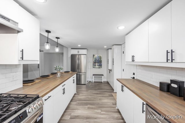 536 E Grant St, Sheridan, MI 48884 - kitchen featuring wooden counters, stainless steel appliances, backsplash, recessed lighting, and under cabinet range hood