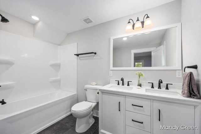 536 E Grant St, Sheridan, MI 48884 - bathroom with double vanity, toilet, tile patterned flooring, and shower / bathtub combination