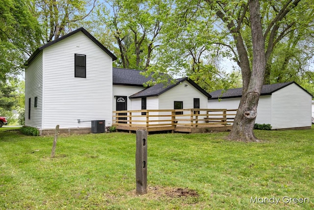 536 E Grant St, Sheridan, MI 48884 - back of house featuring a deck, central AC, and a yard