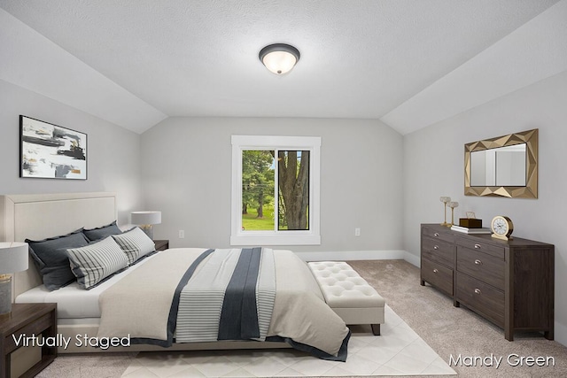536 E Grant St, Sheridan, MI 48884 - bedroom with vaulted ceiling, light colored carpet, baseboards, and a textured ceiling