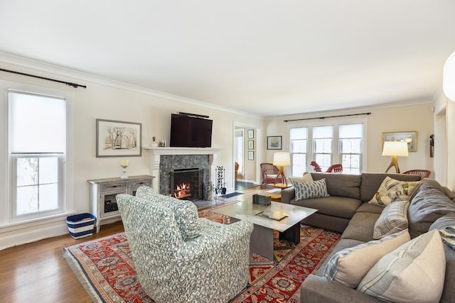 616 S Elm St, Three Oaks, MI 49128 - living room with a high end fireplace, ornamental molding, wood finished floors, and baseboards