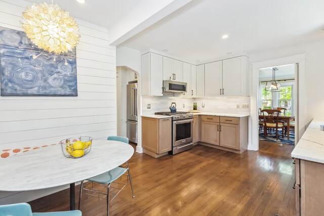 616 S Elm St, Three Oaks, MI 49128 - kitchen featuring high quality appliances, dark wood-type flooring, tasteful backsplash, and recessed lighting
