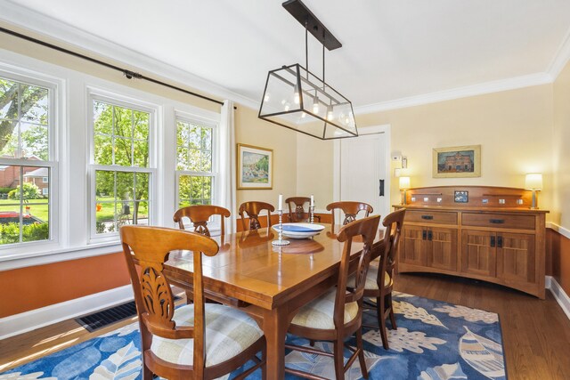 616 S Elm St, Three Oaks, MI 49128 - dining room featuring ornamental molding, dark wood-type flooring, plenty of natural light, and baseboards