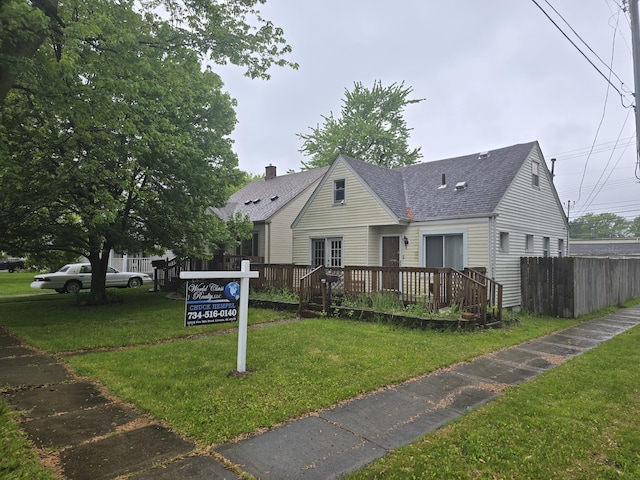 15495 Chelsea, Redford, MI 48239 - view of front facade featuring a shingled roof, a wooden deck, and a chimney