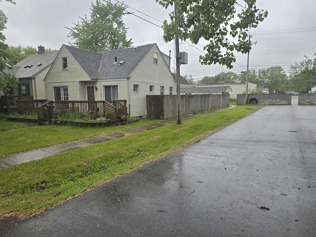 15495 Chelsea, Redford, MI 48239 - view of front facade featuring a shingled roof, a deck, and crawl space