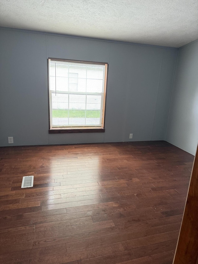 501 N US-131 Hwy # 17, White Pigeon, MI 49099 - empty room with dark wood-type flooring and a textured ceiling