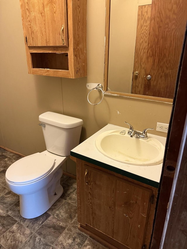 501 N US-131 Hwy # 17, White Pigeon, MI 49099 - bathroom with vanity, toilet, and baseboards