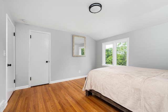 2316 Brockman Blvd, Ann Arbor, MI 48104 - bedroom with wood finished floors, baseboards, and lofted ceiling
