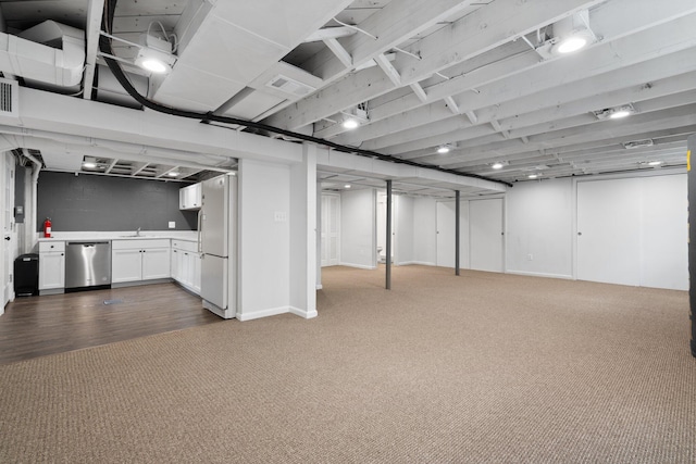 2316 Brockman Blvd, Ann Arbor, MI 48104 - finished basement featuring dark carpet, freestanding refrigerator, and a sink