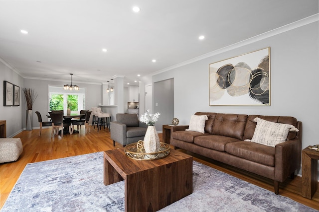 2316 Brockman Blvd, Ann Arbor, MI 48104 - living area with light wood finished floors, crown molding, a chandelier, and recessed lighting