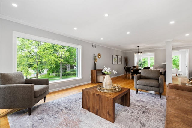 2316 Brockman Blvd, Ann Arbor, MI 48104 - living area featuring ornamental molding, recessed lighting, light wood-style floors, a chandelier, and baseboards