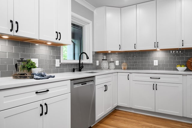 2316 Brockman Blvd, Ann Arbor, MI 48104 - kitchen with stainless steel dishwasher, a sink, and light countertops