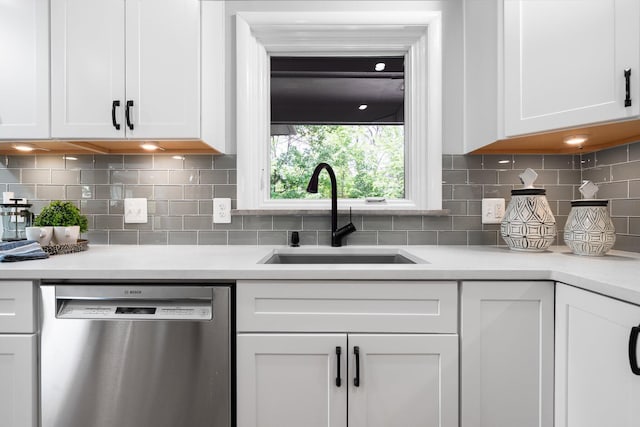 2316 Brockman Blvd, Ann Arbor, MI 48104 - kitchen featuring stainless steel dishwasher, a sink, white cabinetry, and light countertops