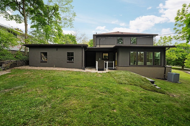 2316 Brockman Blvd, Ann Arbor, MI 48104 - back of house with central air condition unit and a yard