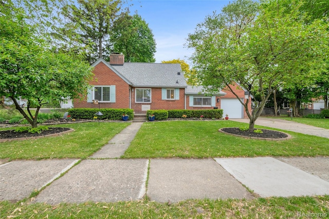 1104 James K Blvd, Pontiac, MI 48341 - view of front of house with brick siding, a front lawn, a chimney, concrete driveway, and an attached garage