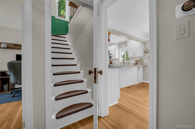 1104 James K Blvd, Pontiac, MI 48341 - stairway featuring wood finished floors and recessed lighting