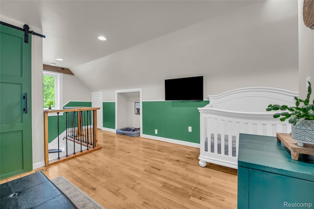 1104 James K Blvd, Pontiac, MI 48341 - additional living space featuring wood finished floors, vaulted ceiling, baseboards, and recessed lighting