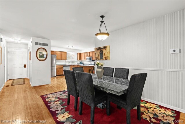 2806 Breckenridge Dr, Brighton, MI 48114 - dining space featuring light wood-style floors and baseboards