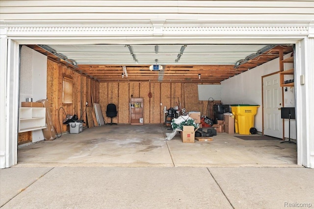 4813 Othello Ln, Northville, MI 48167 - garage featuring a garage door opener