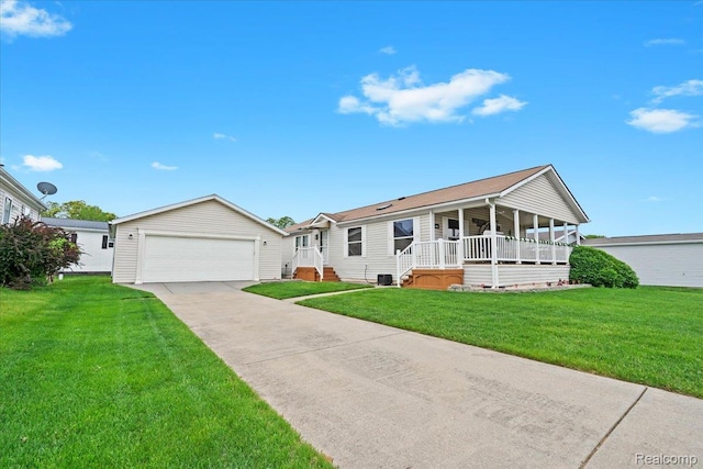 4813 Othello Ln, Northville, MI 48167 - view of front facade featuring an outdoor structure, a front lawn, a detached garage, and covered porch