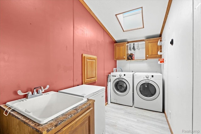 4813 Othello Ln, Northville, MI 48167 - washroom featuring cabinet space, washing machine and clothes dryer, and light wood-type flooring