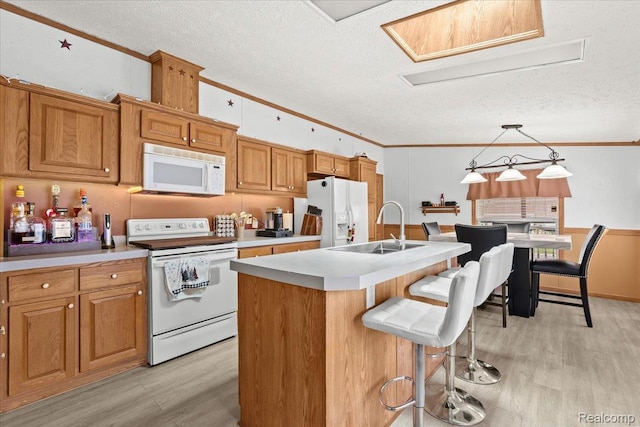 4813 Othello Ln, Northville, MI 48167 - kitchen featuring white appliances, a sink, ornamental molding, light wood-style floors, and a textured ceiling