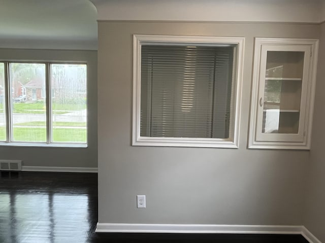 24680 Kenosha St, Oak Park, MI 48237 - spare room with baseboards and dark wood-style floors