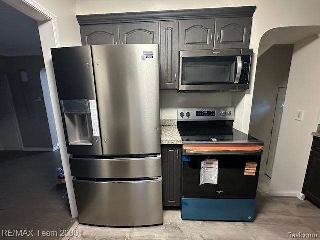 1042 Drexel St, Dearborn, MI 48128 - kitchen with appliances with stainless steel finishes, baseboards, and light countertops