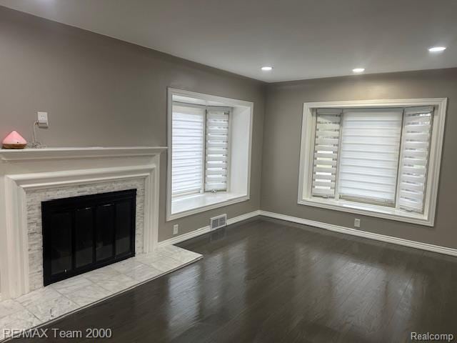 1042 Drexel St, Dearborn, MI 48128 - unfurnished living room featuring wood finished floors, baseboards, a fireplace, and recessed lighting
