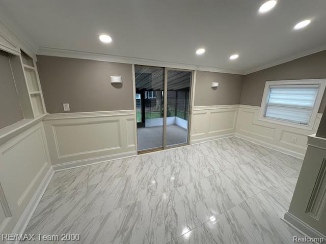 1042 Drexel St, Dearborn, MI 48128 - empty room with ornamental molding, a decorative wall, wainscoting, recessed lighting, and marble finish floors